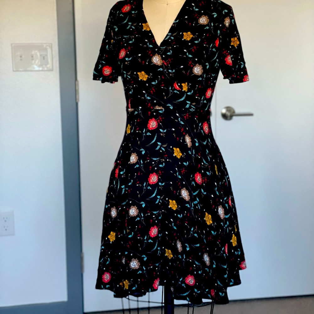 Floral, side zipper and front snap buttons.